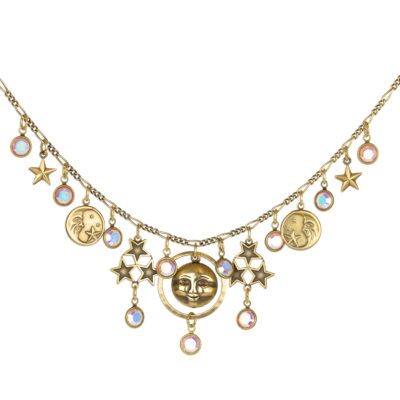Whimsical celestial necklace adorned in sun and star charms. Handcrafted Jewelry by Anne Koplik Designs.